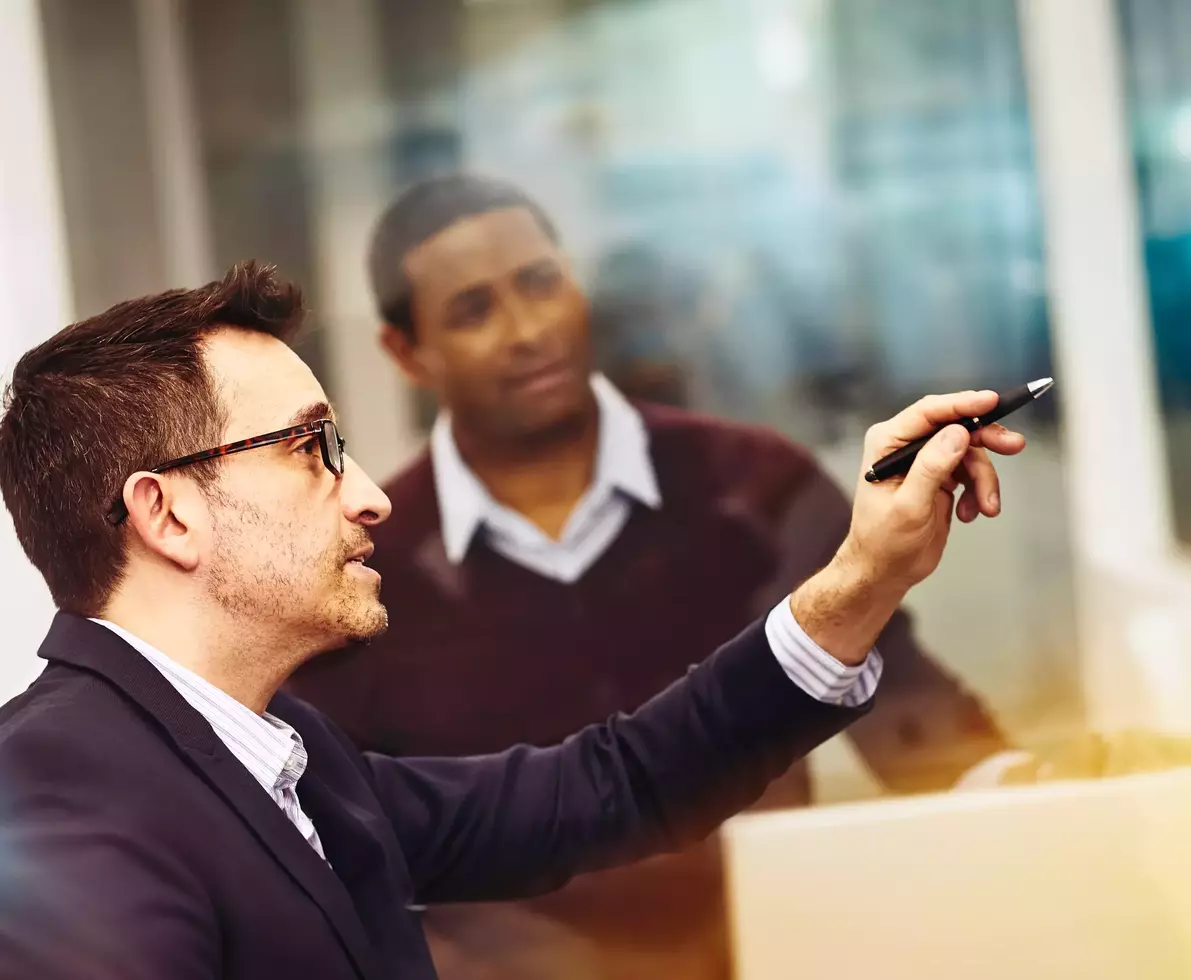 Two men working together in an office
